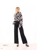 Pantalone vita alta a palazzo Pdk